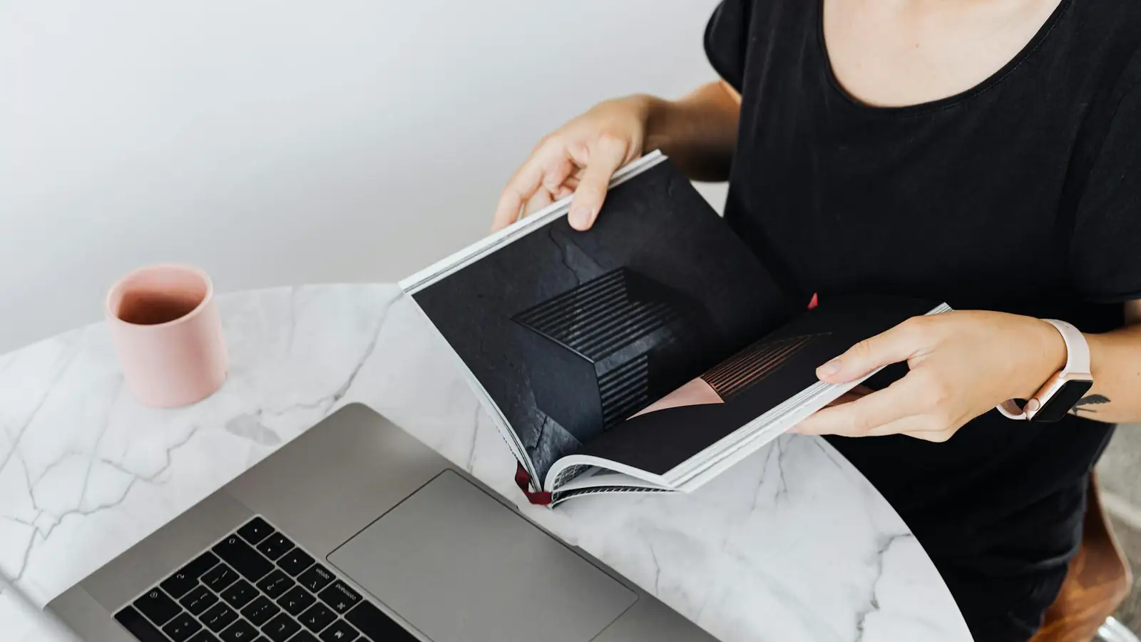 Travel agency professional working at a desk with laptop on travel bookings