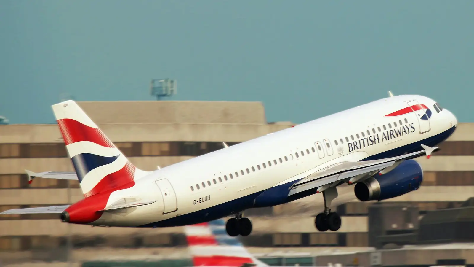 Commercial passenger aircraft taking off from an international airport runway